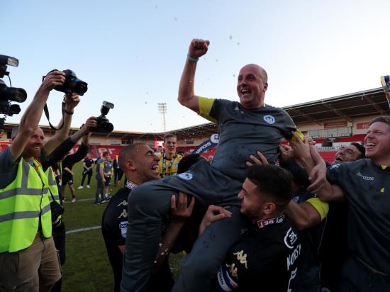 Paul Cook toasts a week to remember after Wigan lift League One title