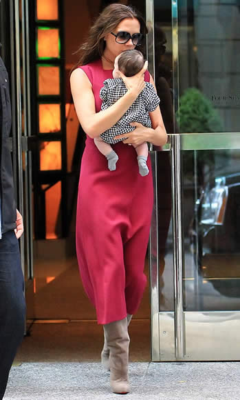 Victoria Beckham shows off Harper Seven at New York Fashion Week - Dad David's girl looks stylish in checks