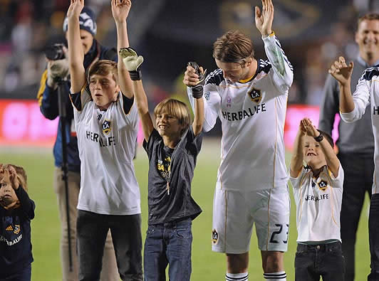 David Beckham and boys bid fond farewell to fans