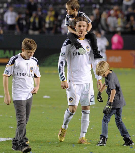 David Beckham and boys bid fond farewell to fans