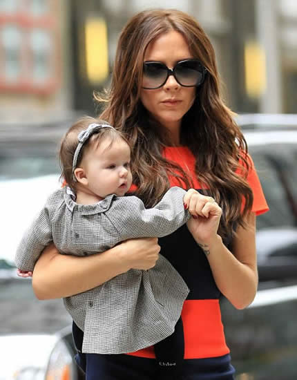 Victoria Beckham takes her living doll Harper to iconic New York toy store FAO Schwarz