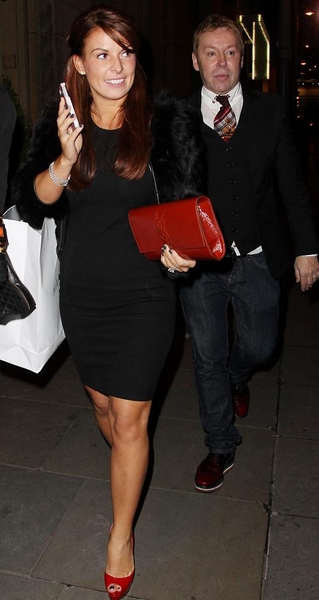 Rooney goes red as she parties with pals