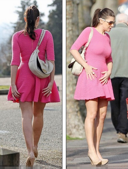Hot in pink! Imogen Thomas dress matches her blushes as she goes out in a floaty dress on a very windy day