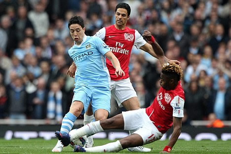 Former Gunner Nasri blasts back as Man City star says: We'll win a trophy before Arsenal