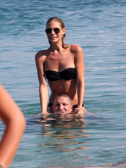 Bastian Schweinsteiger went on a summer beach vacation with his girlfriend