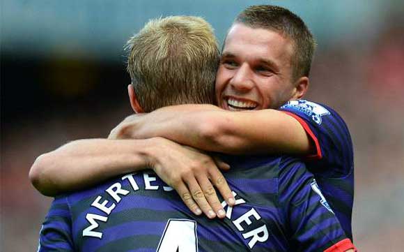 Liverpool 0-2 Arsenal: Podolski & Cazorla strikes hand Gunners impressive Anfield victory