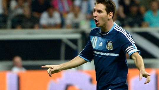 Messi magic fires Argentina top