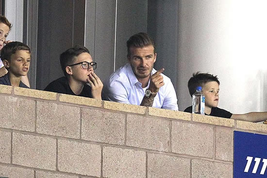 Brooklyn Beckham looks good in specs from mum's collection