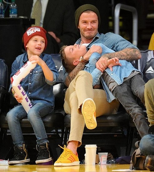 David Beckham Footie ace grapples with son Romeo
