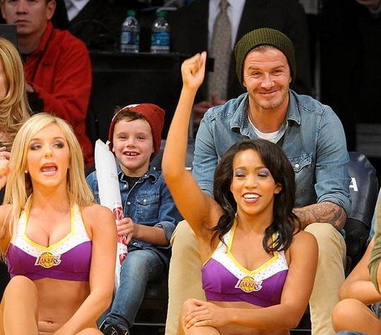 David Beckham Footie ace grapples with son Romeo