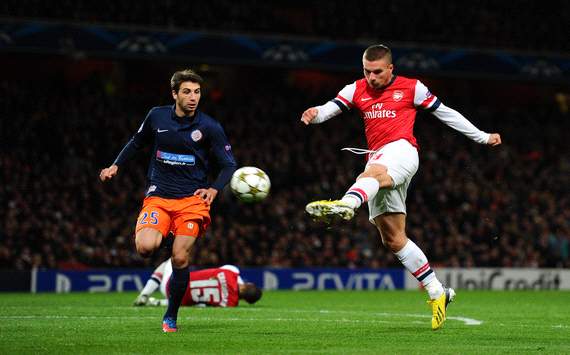 Arsenal 2-0 Montpellier: Wilshere & Podolski strikes send Gunners through