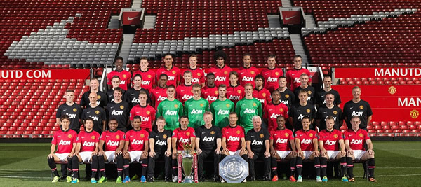 Here's what the title looks like, David... but will you win it for yourself this season? New boss Moyes takes centre stage as Manchester United stars gather for first team photo without Fergie