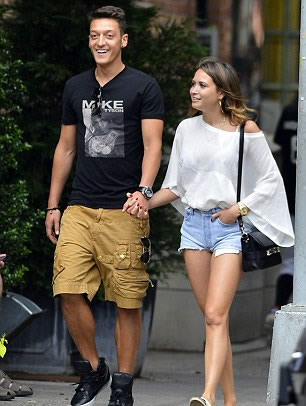 Football focus! Arsenal star Ozil trades his boots for the camera lens as he snaps stunning girlfriend Mandy Capristo