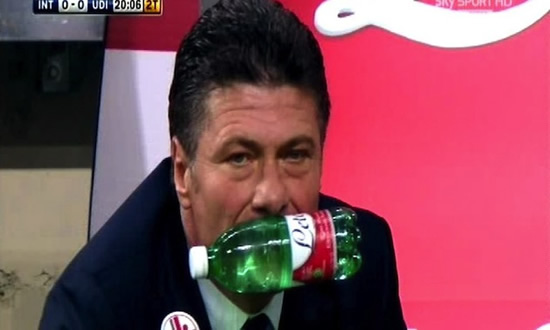 Inter manager Walter Mazzarri is so frustrated that he's picking up water bottles with his teeth