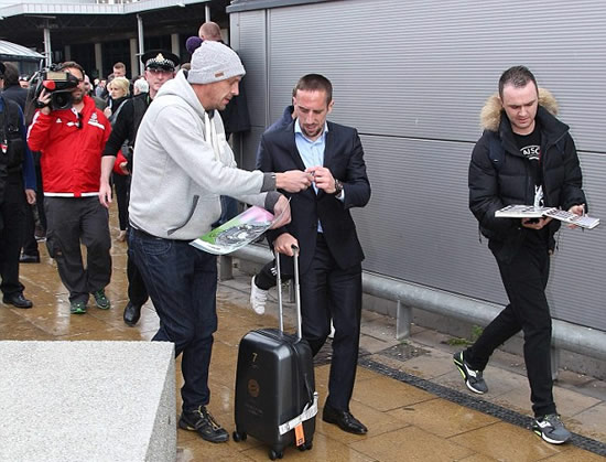 Ribery leaves Manchester airport in the grasp of copper... but before United fans get their hopes up, it's only for crowd control