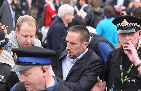Ribery leaves Manchester airport in the grasp of copper... but before United fans get their hopes up, it's only for crowd control