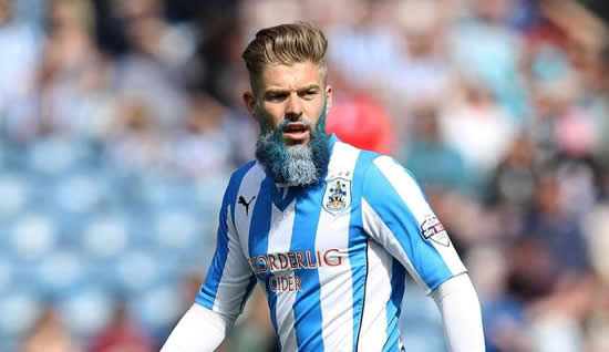Huddersfield's Adam Clayton dyes his massive beard in club colors for charity