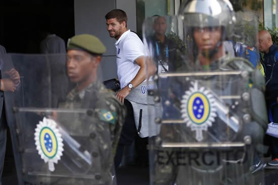 England squad arrive at Rio hotel in Brazil to be greeted by ranks of riot police