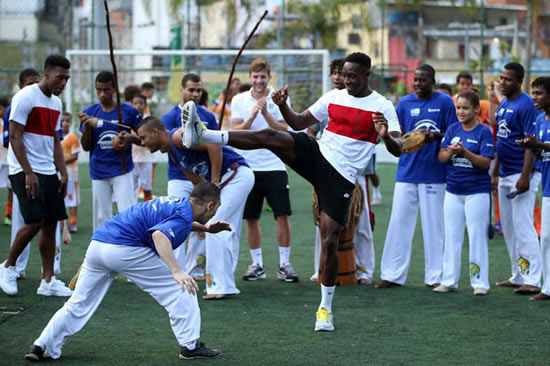 Slumdogs and Millionaires: Football stars meet children from Rio slums
