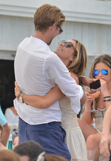 Beats being in Brazil! Abbey Clancy and Peter Crouch party hard on booze-fuelled break