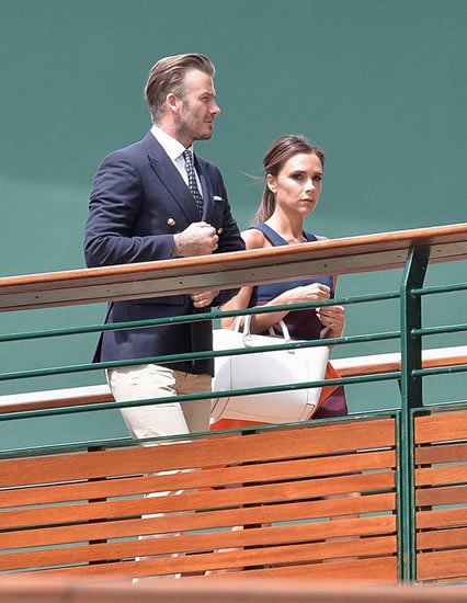 David Beckham and wife Victoria take their seats in the Royal Box for Mens Wimbledon final