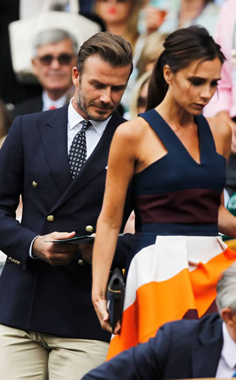 David Beckham and wife Victoria take their seats in the Royal Box for Mens Wimbledon final