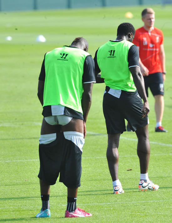 What are you up to Mario? Liverpool star Balotelli drops his shorts in training