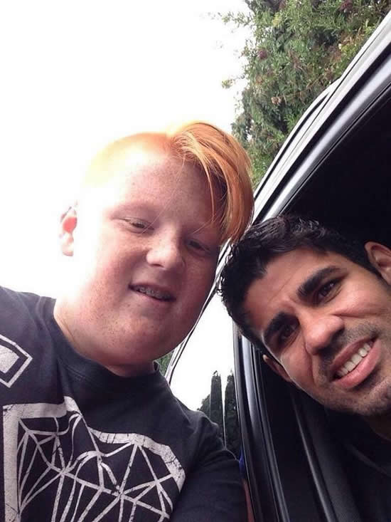 Chelsea’s Diego Costa stops for a selfie with a fan, fan steals all the attention