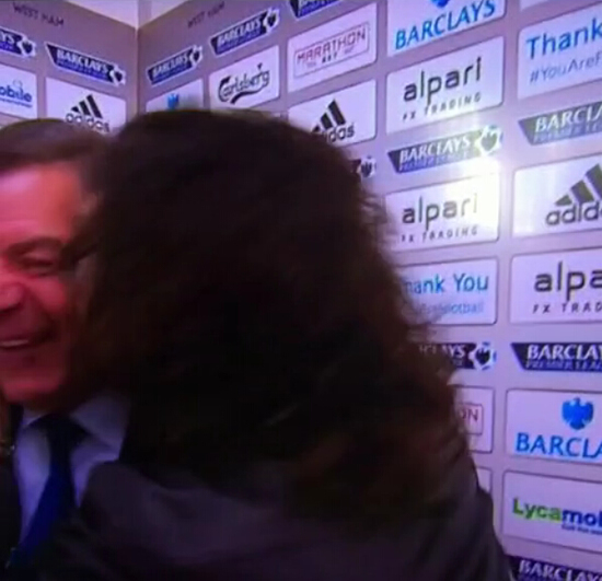 West Ham fan Russell Brand kisses Sam Allardyce during his post-match interview