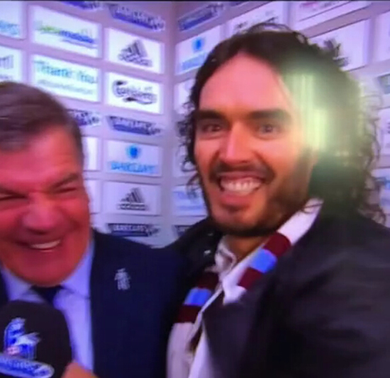 West Ham fan Russell Brand kisses Sam Allardyce during his post-match interview