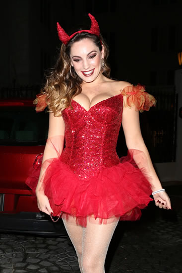 Saucy devil: Kelly Brook’s boobs spill out of Halloween costume