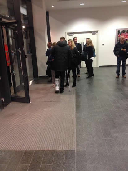 Man United's Luke Shaw leaves Arsenal wearing a protective boot & on crutches