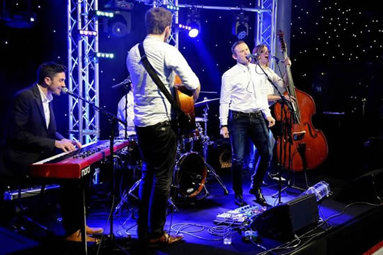 Manchester United captain Wayne Rooney has uploaded a picture of himself singing on stage at the club’s Christmas party!