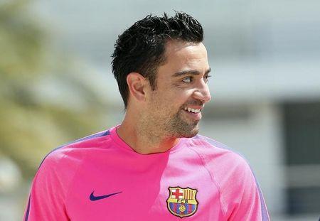 Xavi would relish chance to copy Guardiola and coach Barca