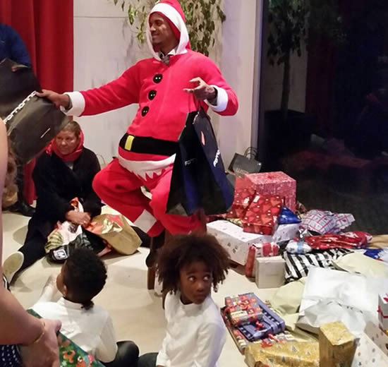 Man United loan star Nani (Sporting) dresses up as Santa Claus to deliver presents