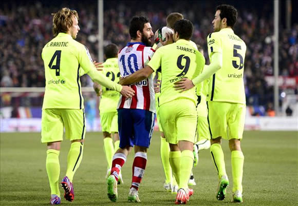 Atletico Madrid midfielder Arda Turan throws boot at assistant referee