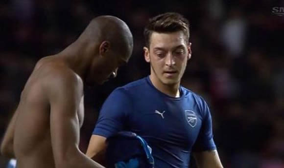 Mesut Ozil SWAPS shirts at half-time as Arsenal take on Monaco