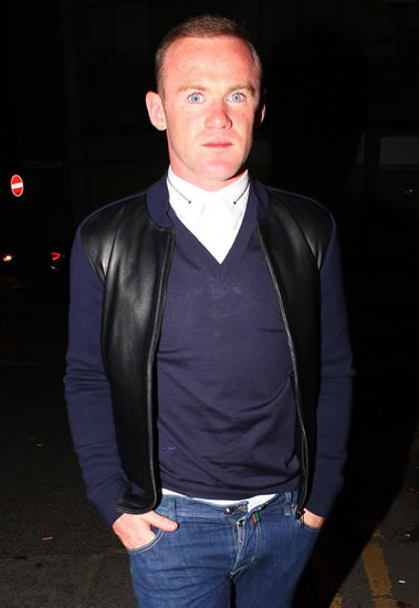 Man Utd stars paint the town red... but Rooney forgets to do up his trousers!