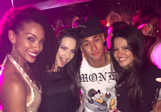 Neymar shows off his fancy footwork with female dancers on stage in Brazil