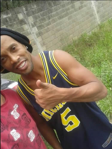 Ronaldinho poses for an awkwardly brilliant selfie just moments after rolling his car into a ditch
