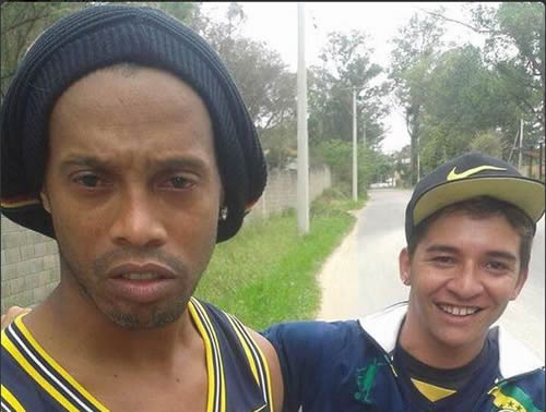 Ronaldinho poses for an awkwardly brilliant selfie just moments after rolling his car into a ditch