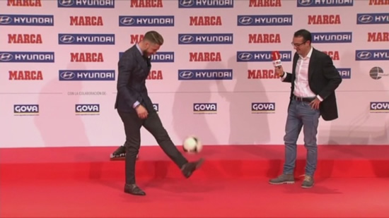 Real Madrid’s Sergio Ramos does keepy-ups in his shoes at MARCA Awards