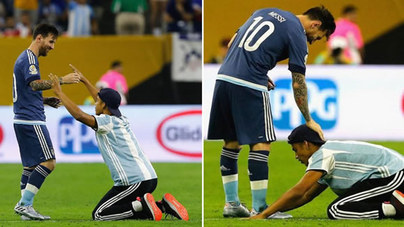 Argentina fan invades pitch to bow to Messi