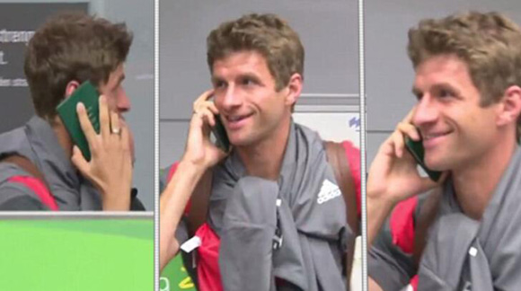 Thomas Muller Dodges The Press By Having A Phone Call...On His Passport
