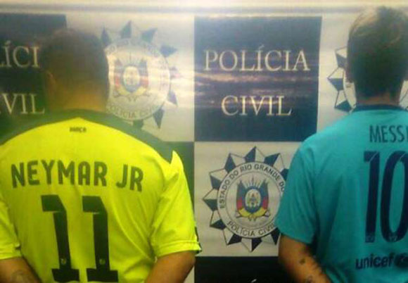 Incredible police photo shows Messi and Neymar fanboys being arrested in club shirts