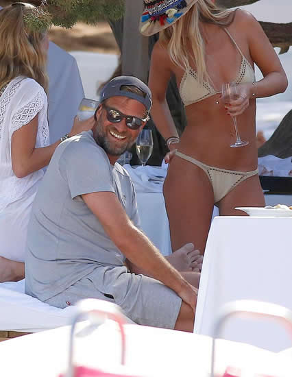 Liverpool boss Jurgen Klopp keeps his cool in daft umbrella hat and chills with a cigarette on holiday in sizzling Ibiza