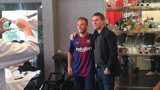 Robert Fernandez also photographed with Arthur in a Barcelona shirt