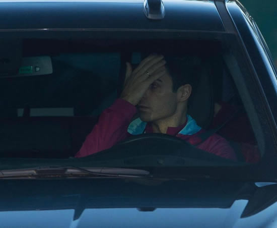 Mikel Arteta covers his face on way to training after being hurt in Manchester derby tunnel bust-up
