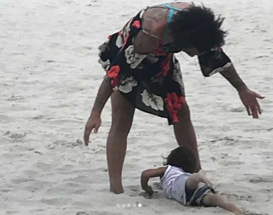 Real Madrid star Marcelo spotted in a dress while playing football on Brazilian beach