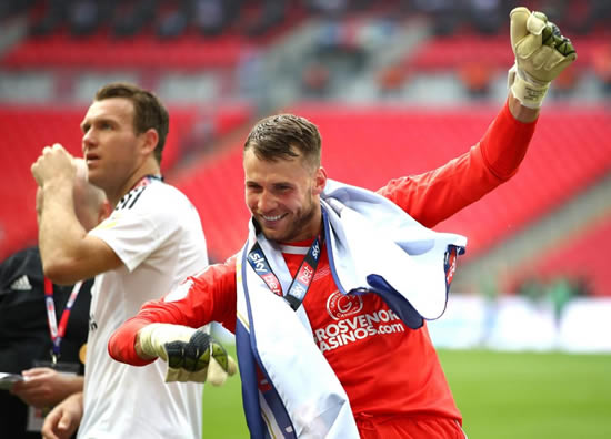 Fulham goalkeeper Marcus Bettinelli celebrates Premier League promotion with flare and dance